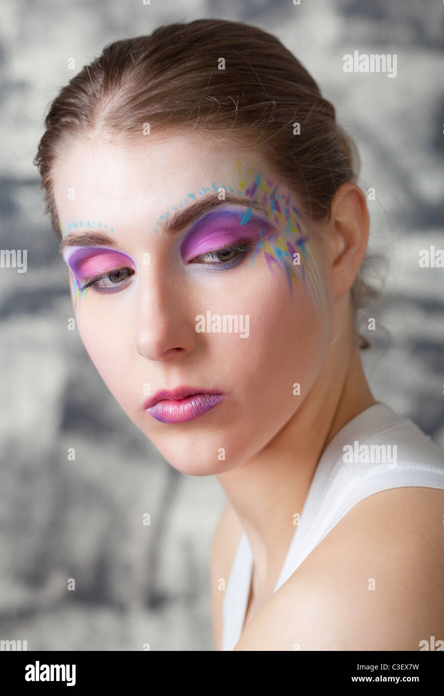 portrait of a pretty young woman with face art Stock Photo
