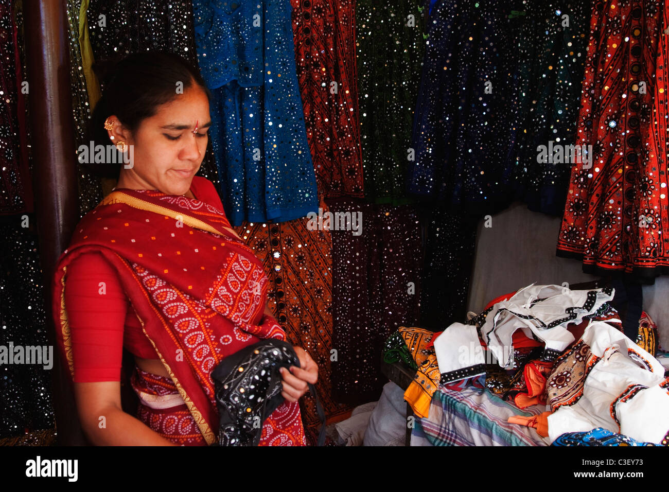 Woman standing at a clothing store, New Delhi, India Stock Photo