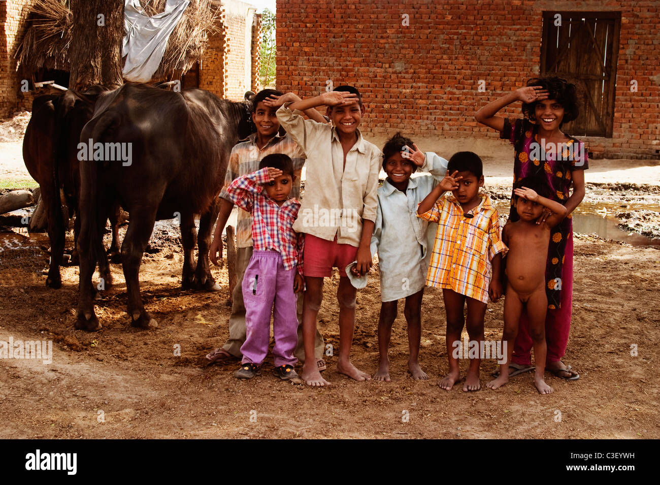 Portrait of children saluting, Agra, Uttar Pradesh, India Stock Photo