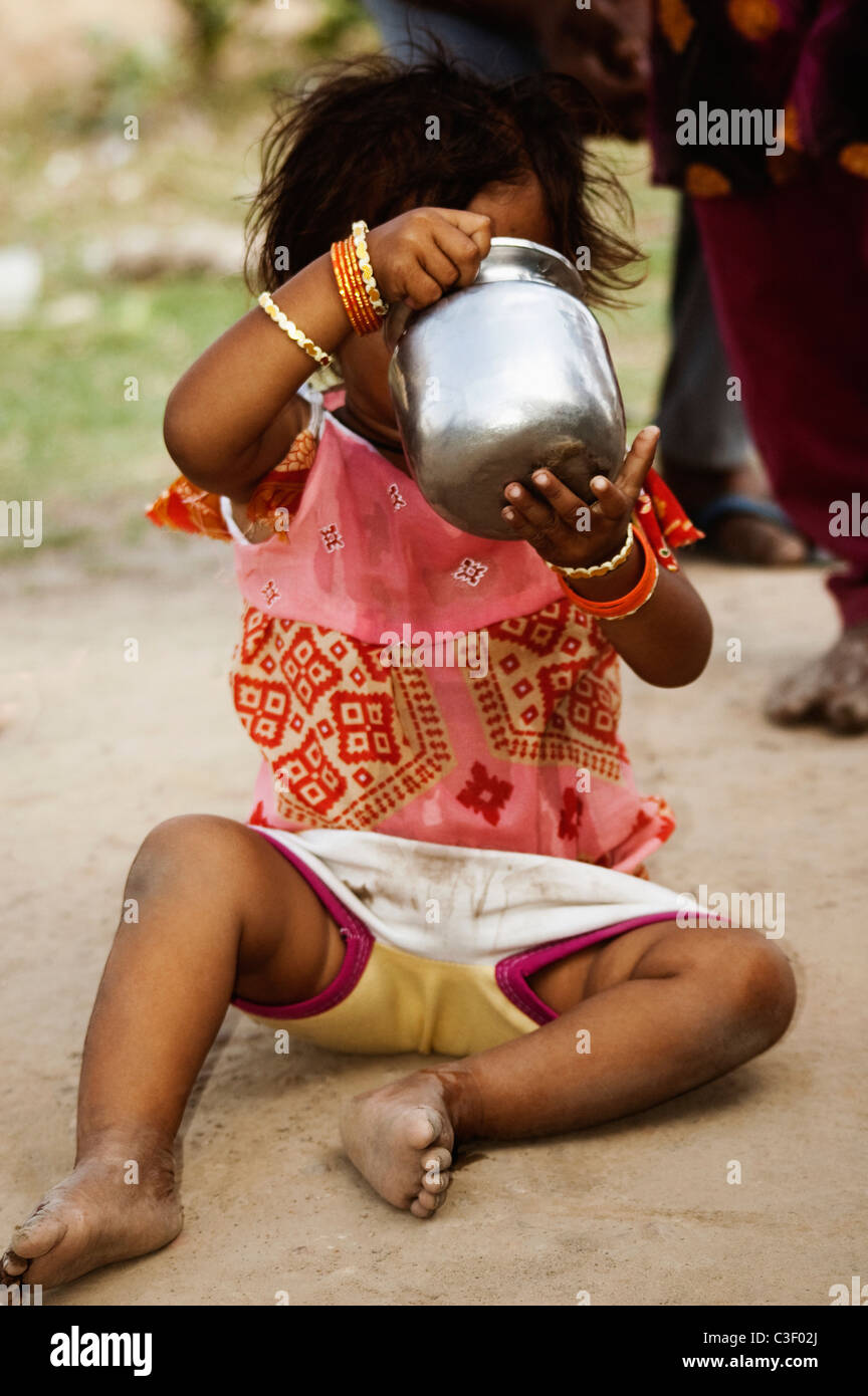 Girl drinking water, Agra, Uttar Pradesh, India Stock Photo