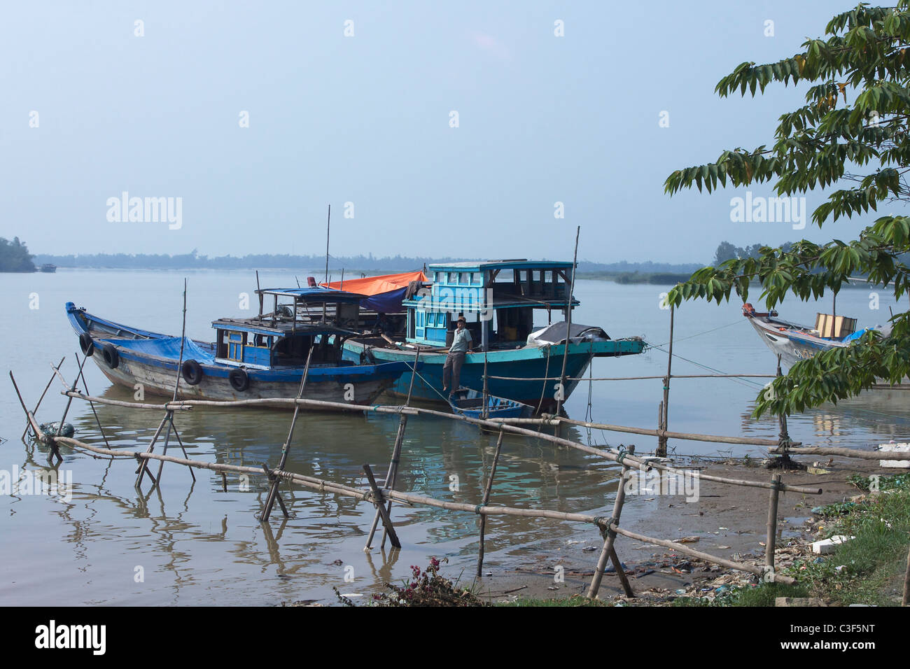 Fishing boat on Thu Bon River, Hoi An, Vietnam Stock Photo