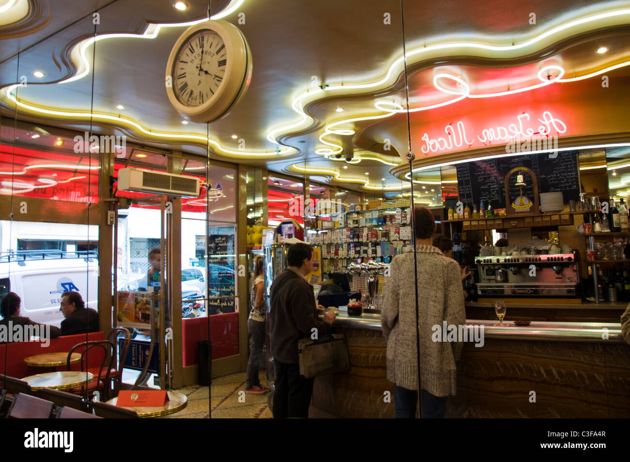 Reflections in a cafe bar tabac mirrored wall A Jean Nicot Rue Saint Honore 1er Paris France Stock Photo