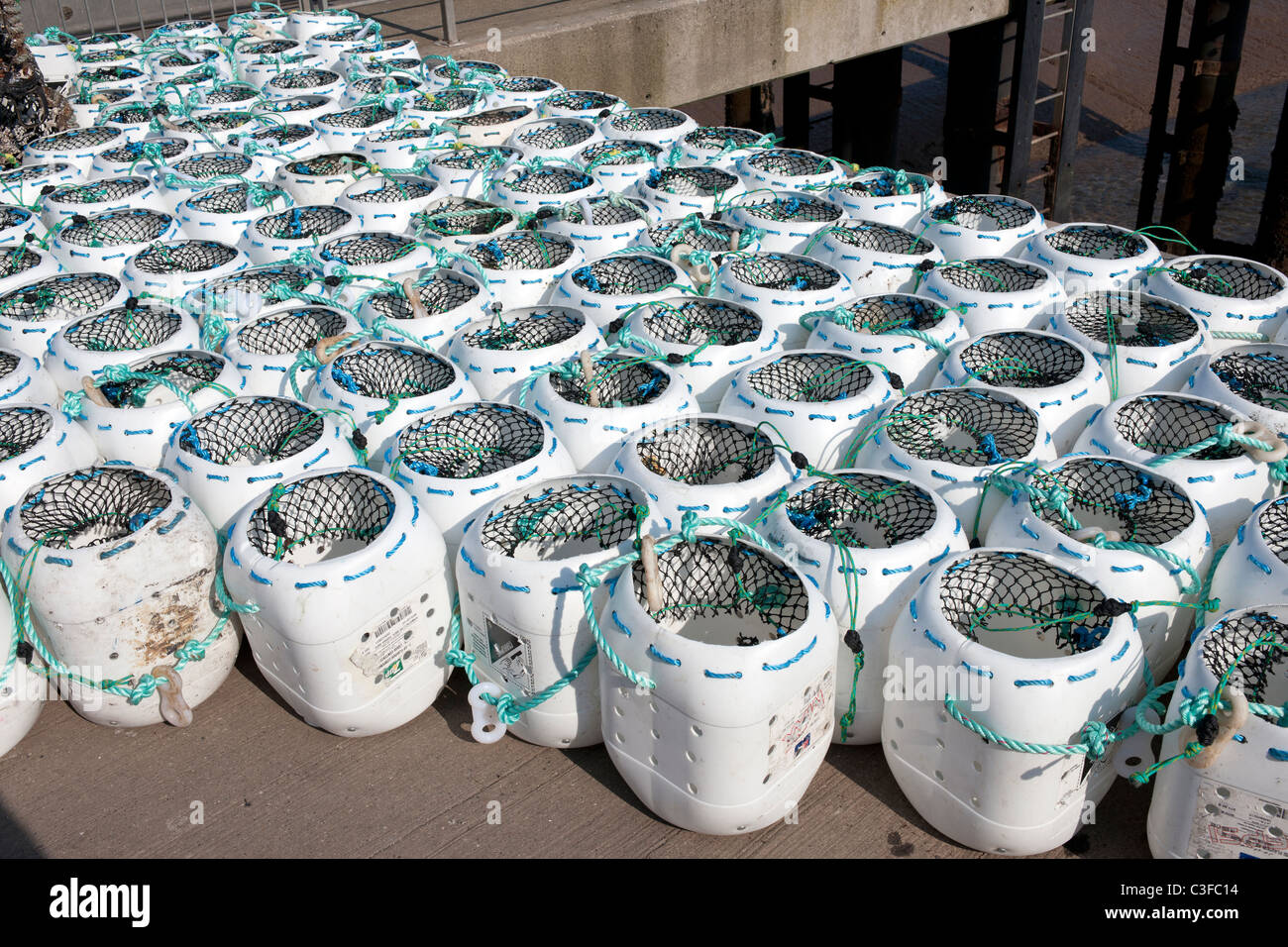 modern lobster pots made from reused plastic containers, quayside