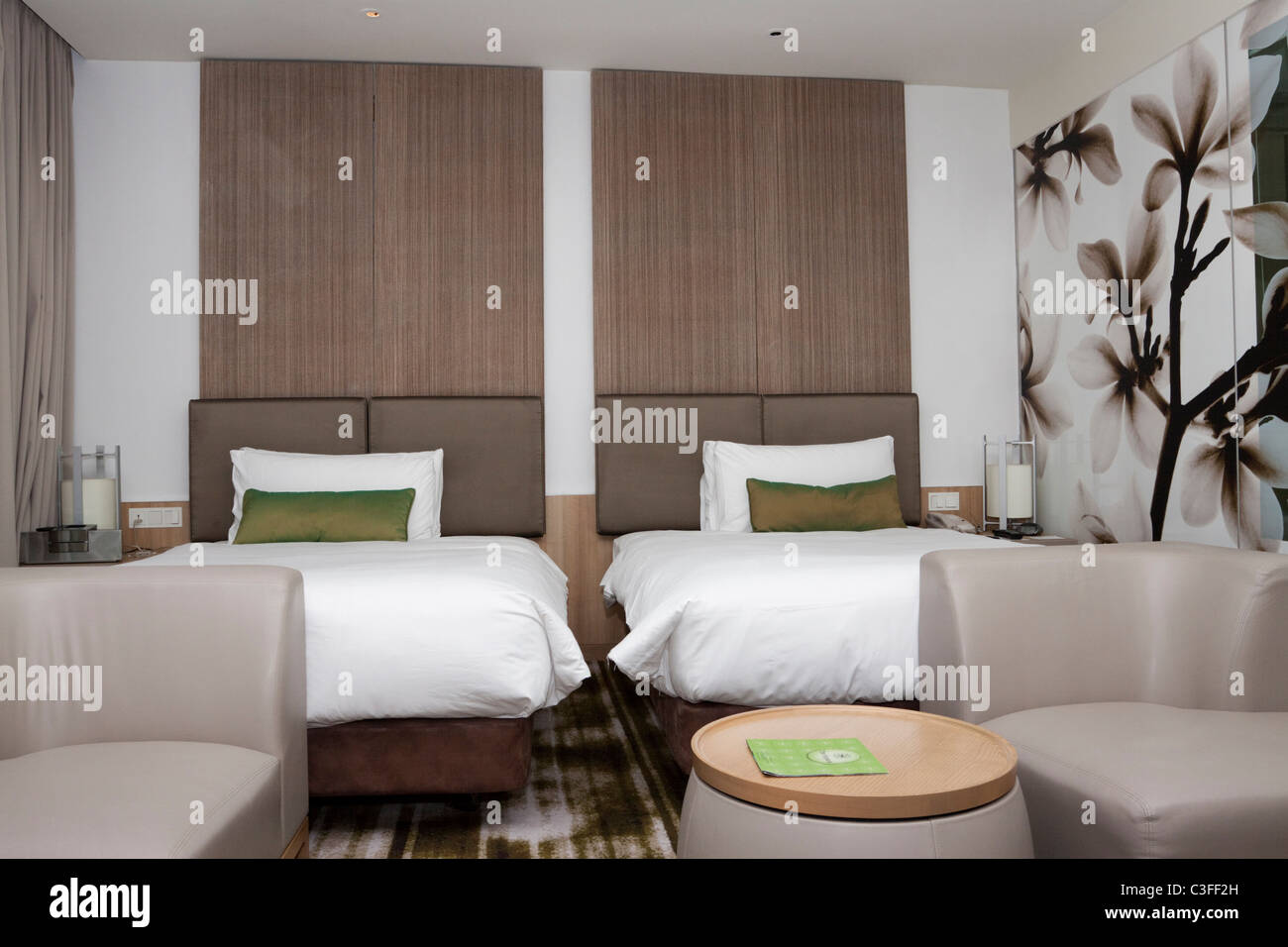 Twin beds in a hotel room, Crowne Plaza, Changi Airport, Singapore Stock Photo