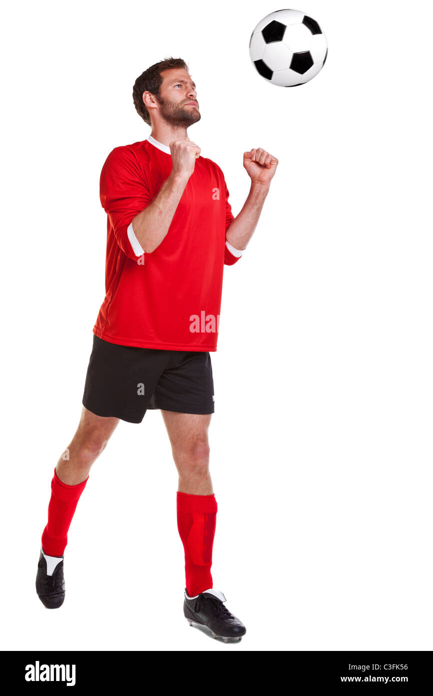 Photo of a footballer or soccer player cut out on a white background,. Stock Photo