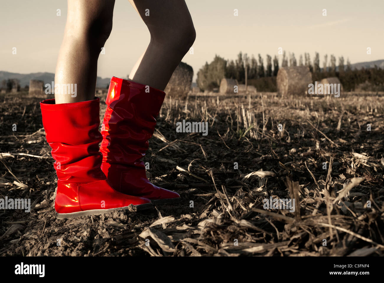 Girl in red wellington boots in field Stock Photo - Alamy
