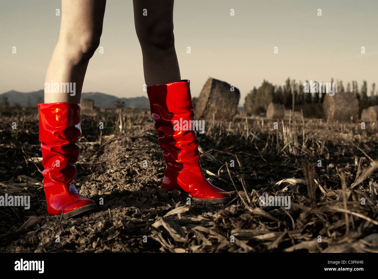 Girl in red wellington boots in field Stock Photo - Alamy