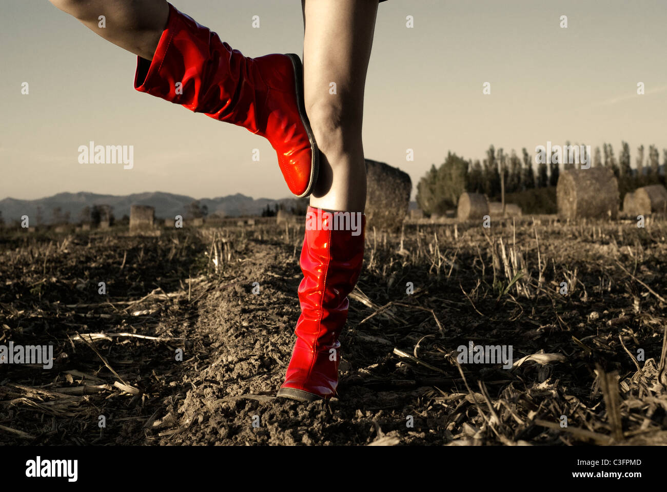 Girl in red wellington boots in field Stock Photo - Alamy