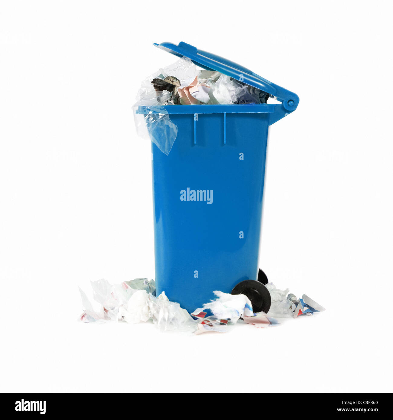 overflowing blue garbage bin Stock Photo