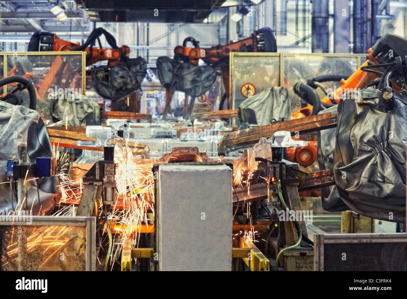 robots welding in a car factory Stock Photo