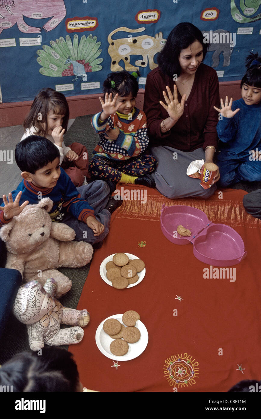 reception class in primary school learning to count with cookies and teddy bears Stock Photo
