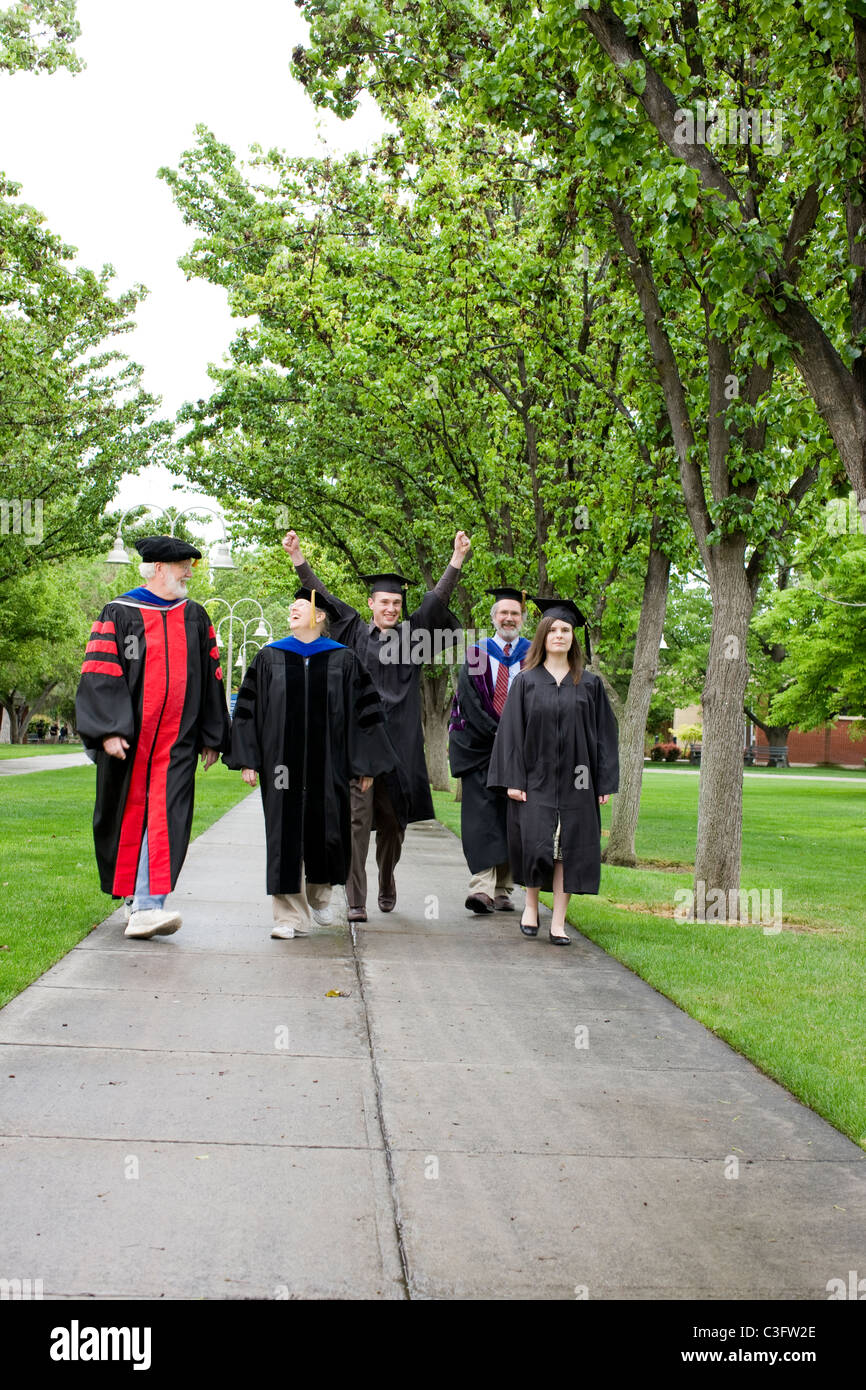 Professors and students walking to graduation Stock Photo