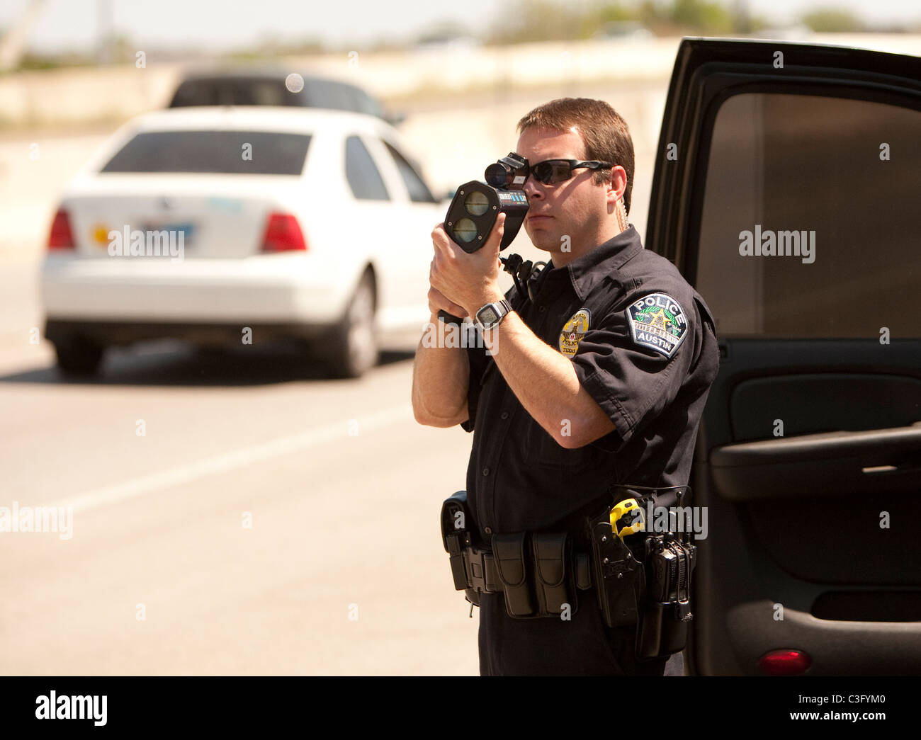 Policeman Using Radar Gun To Detect Speeding Car #2 Metal Print by