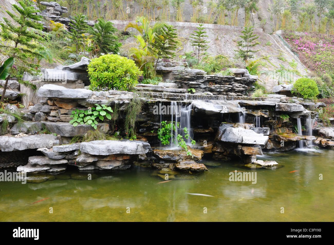 Chinese rockery garden with pond and waterfall Stock Photo