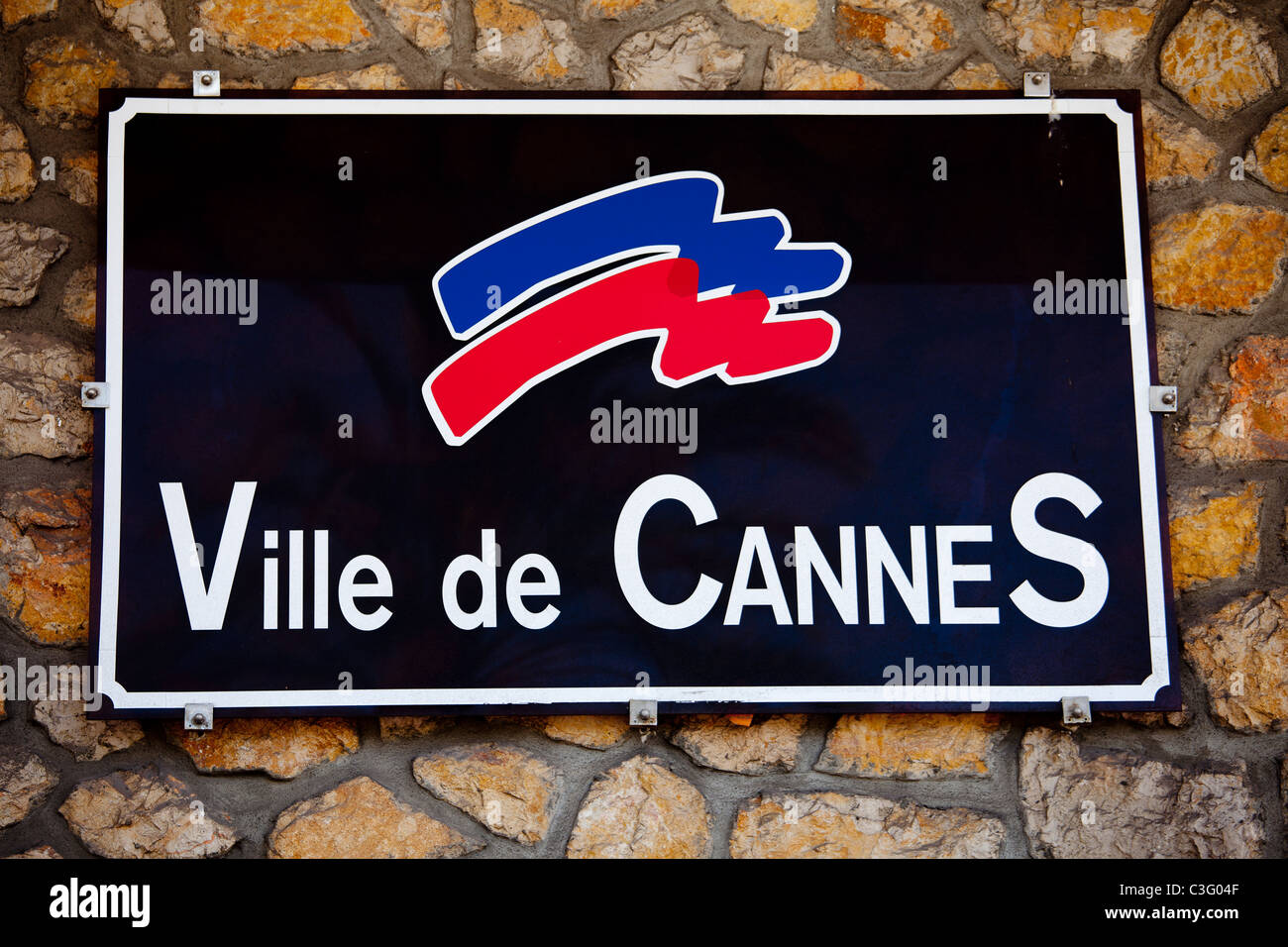 Town sign for Cannes, home of the film festival, South of France. Stock Photo
