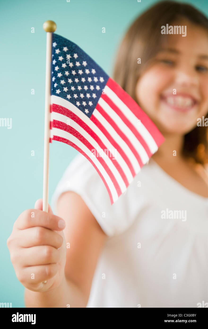 Hispanic girl holding American flag Stock Photo - Alamy