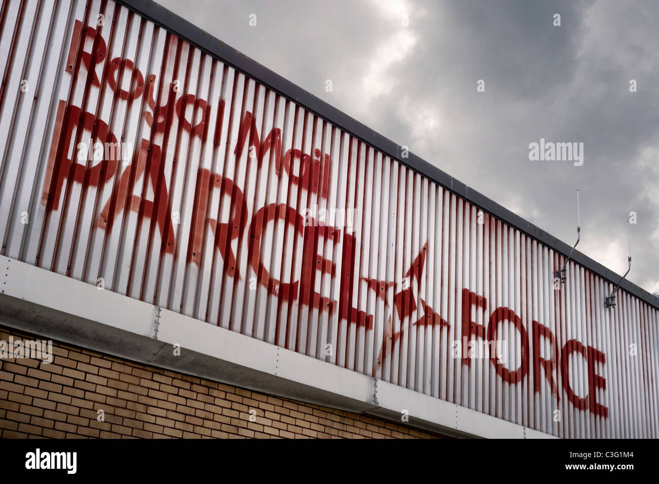 ROYAL MAIL PARCEL FORCE A Run Down  Building Against a Grey and Imposing Sky Shoreham by Sea Sussex UK Stock Photo