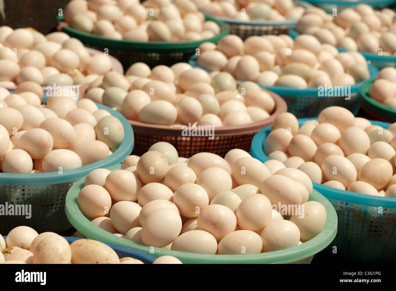 many fresh eggs in basket in asian street market Stock Photo