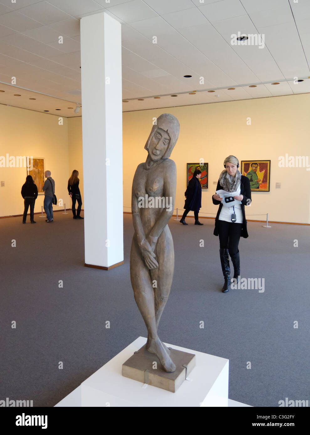 Woman looking at painting inside the Neue Nationalgalerie in Kulturforum Berlin Germany Stock Photo