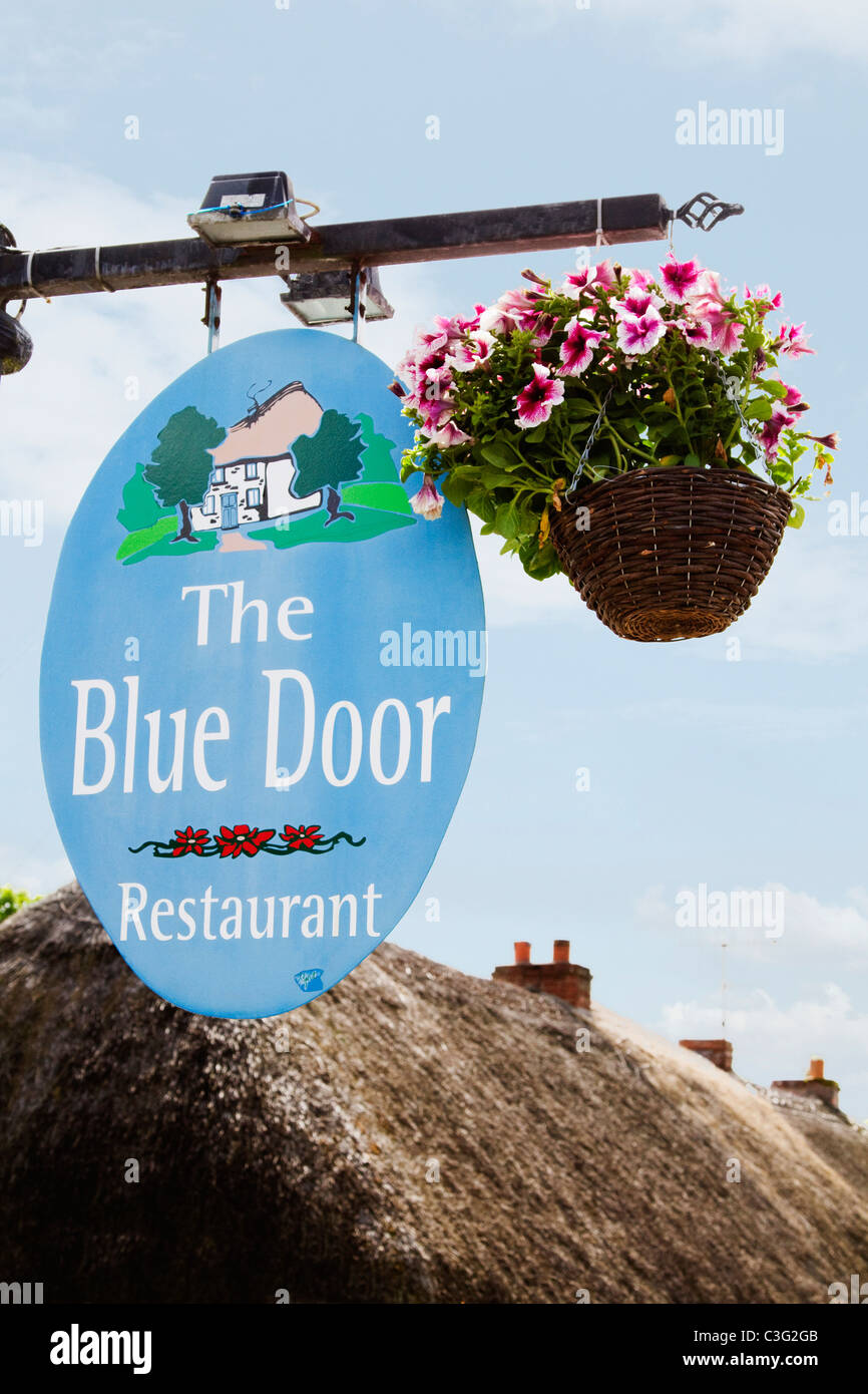 Low angle view of signboard of a restaurant, The Blue Door Restaurant, Adare, County Limerick, Republic of Ireland Stock Photo