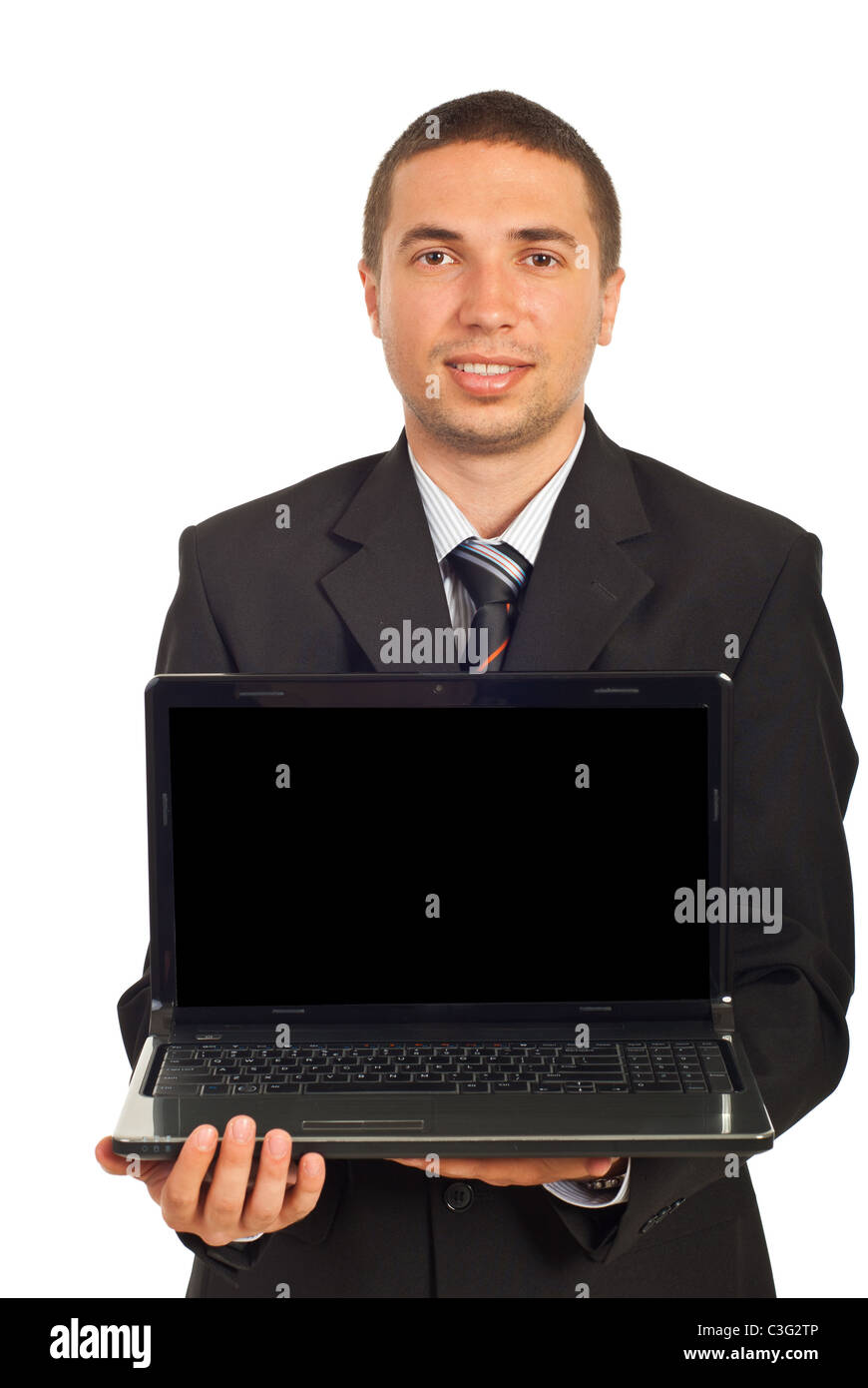 Smiling executive holding laptop with blank screen isolated on white ...