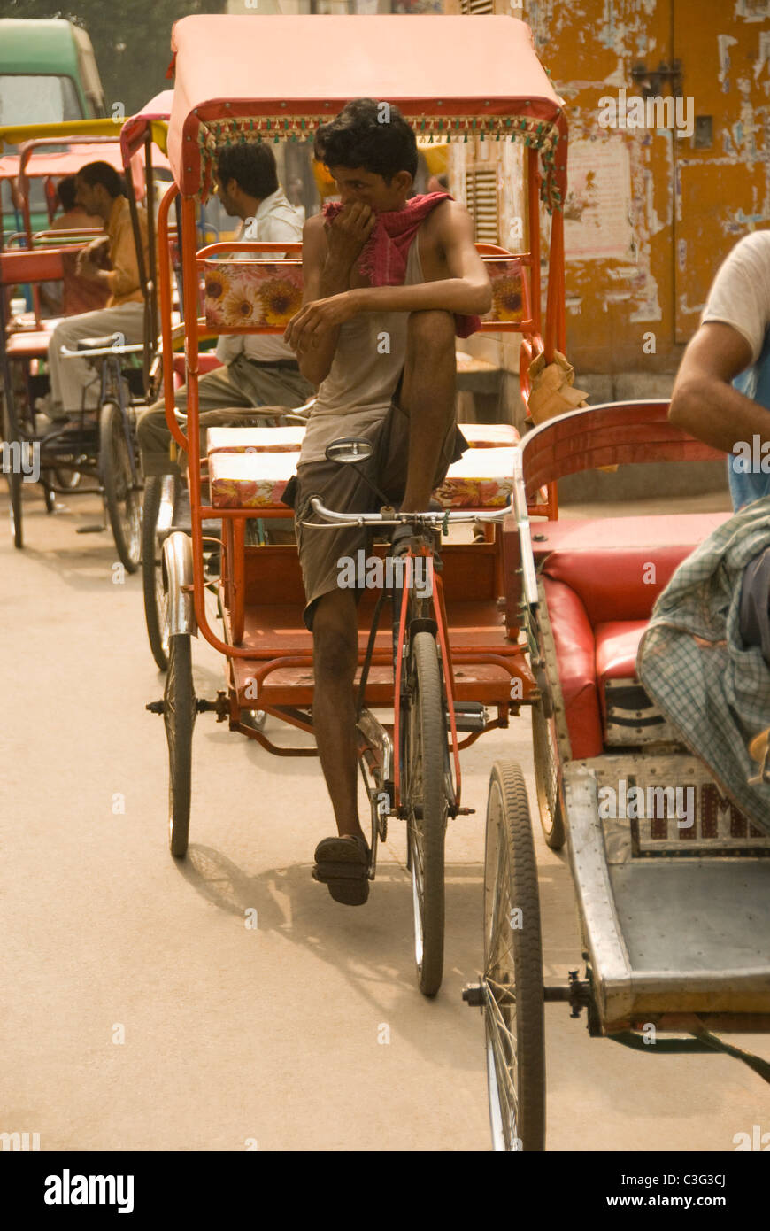 Rickshaw pullers on a street, Chandni Chowk, Delhi, India Stock Photo