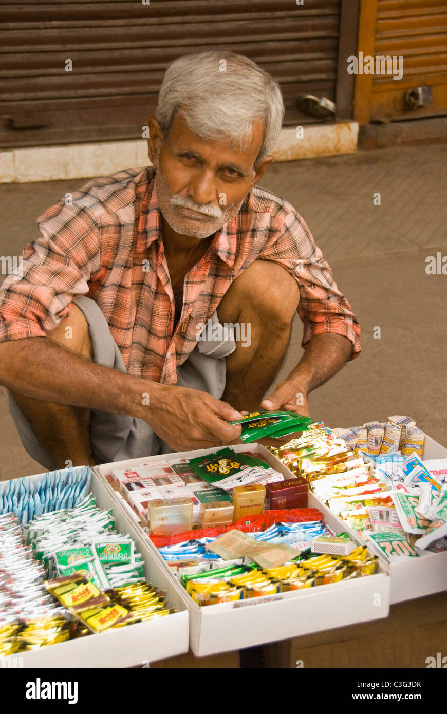 Street vendor selling tobacco products, Chandni Chowk, Delhi, India Stock Photo