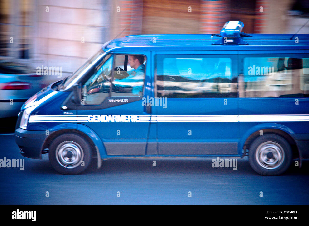 Speeding police van - France. Stock Photo
