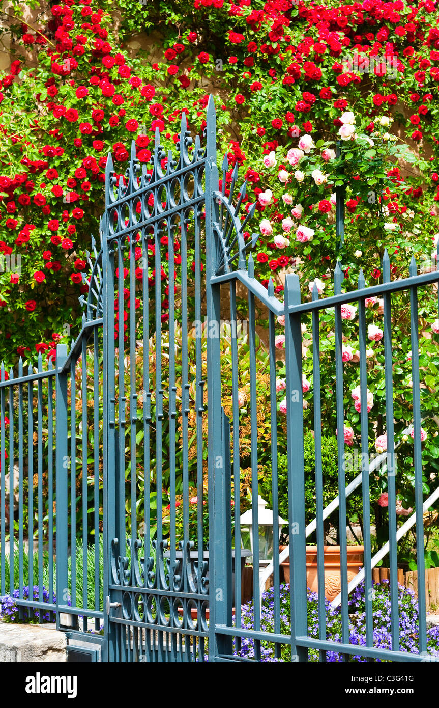 Wrought iron garden gate and railings - France. Stock Photo