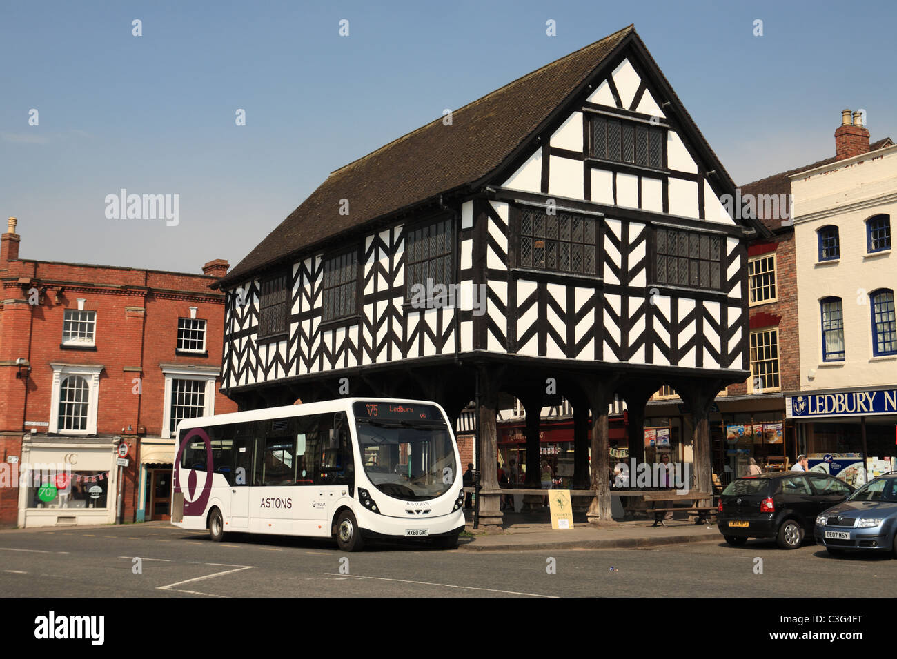 A No. 675 bus stands at Ledbury Market House, a 17th century building