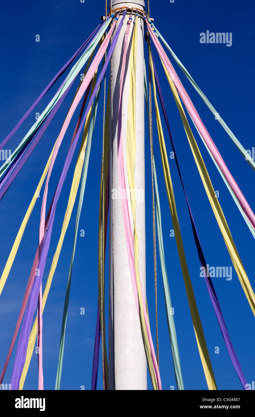 ribbons hanging from a maypole on may day in the uk Stock Photo