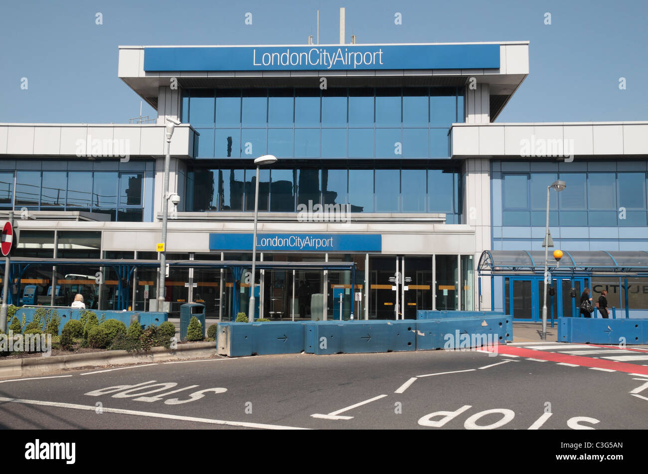 The Main terminal entrance of London City Airport with concrete vehicle crash barriers in the Docklands, London, UK. Stock Photo