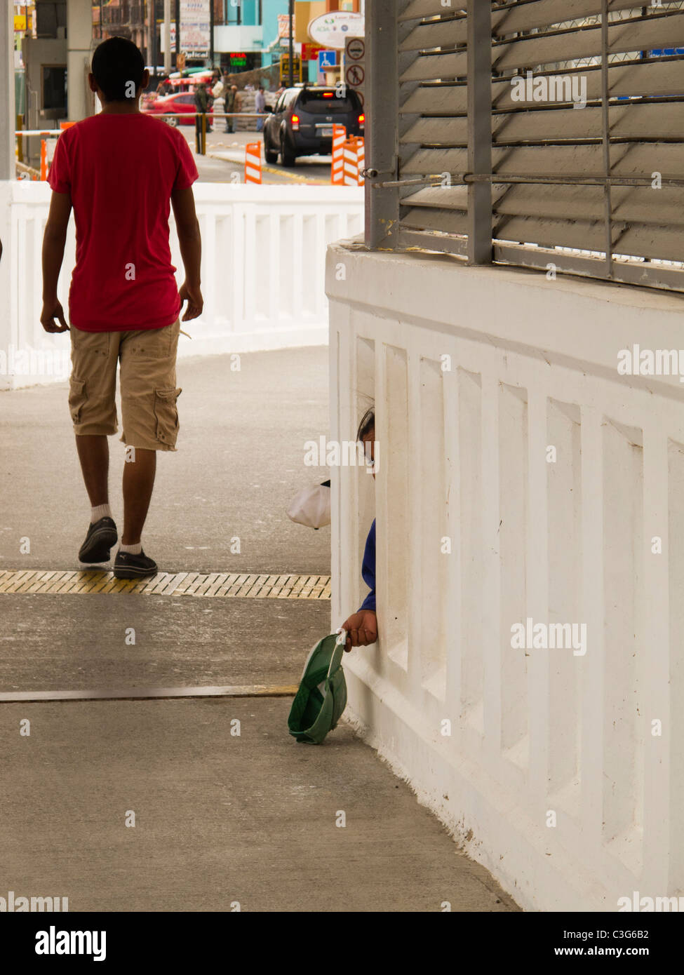 Beggars at the foot of the bridge at the border town of Nuevo Progreso, Tamaulipas, Mexico Stock Photo