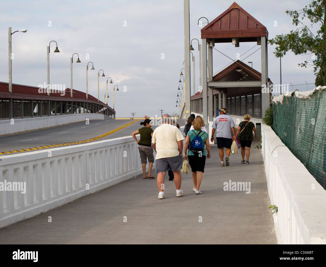 Tourists cross bridge from Nuevo Progreso, Tamaulipas, Mexico to