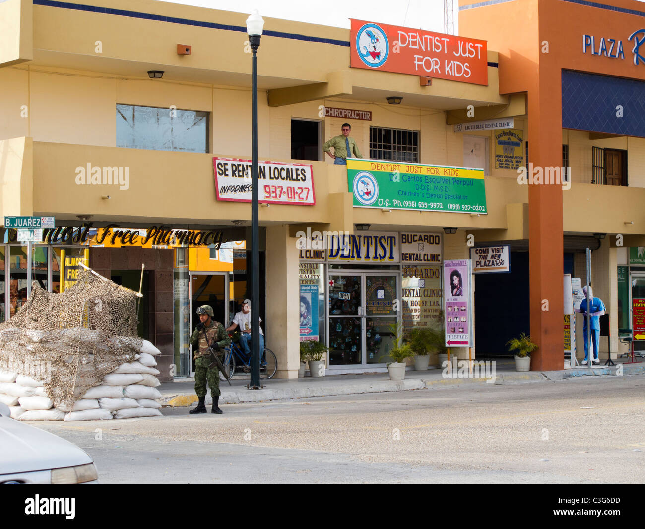 Mexican soldier stands guard on street corner in Nuevo Progreso, Tamaulipas, Mexico. Stock Photo