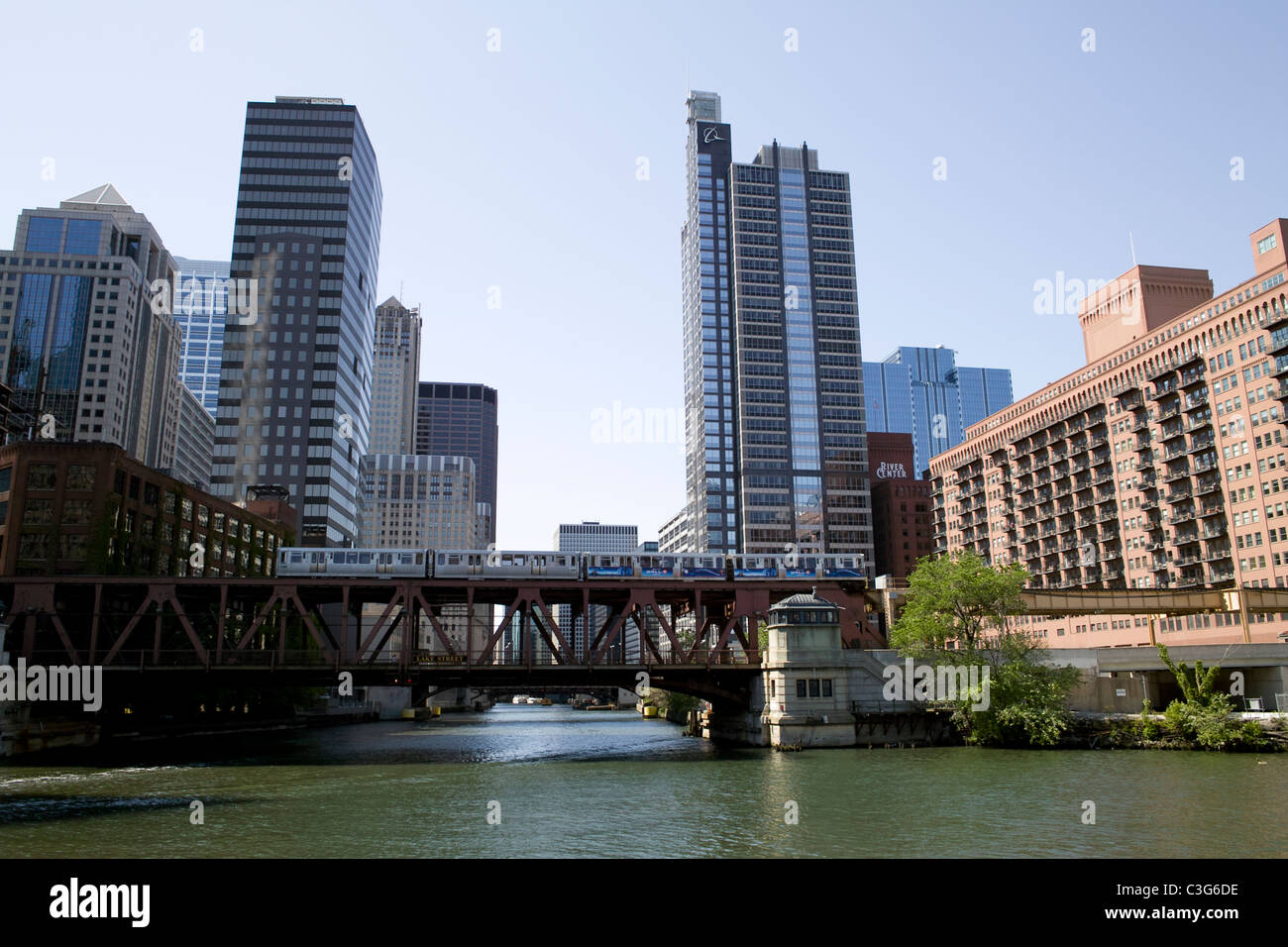 Buildings and a train along the Chicago River in Chicago, Illinois. Stock Photo