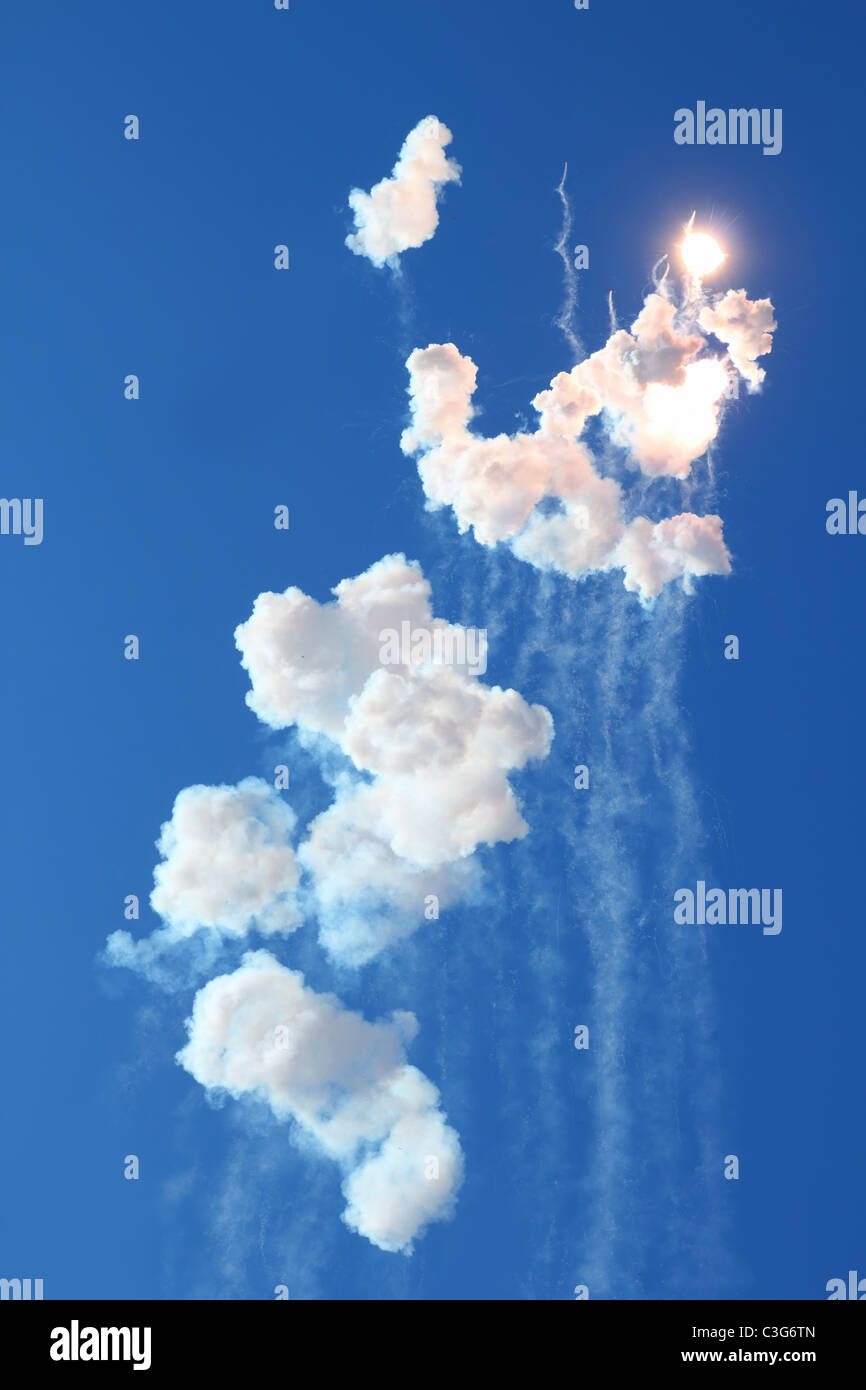 blue sky with fireworks firecrackers white clouds daytime Stock Photo