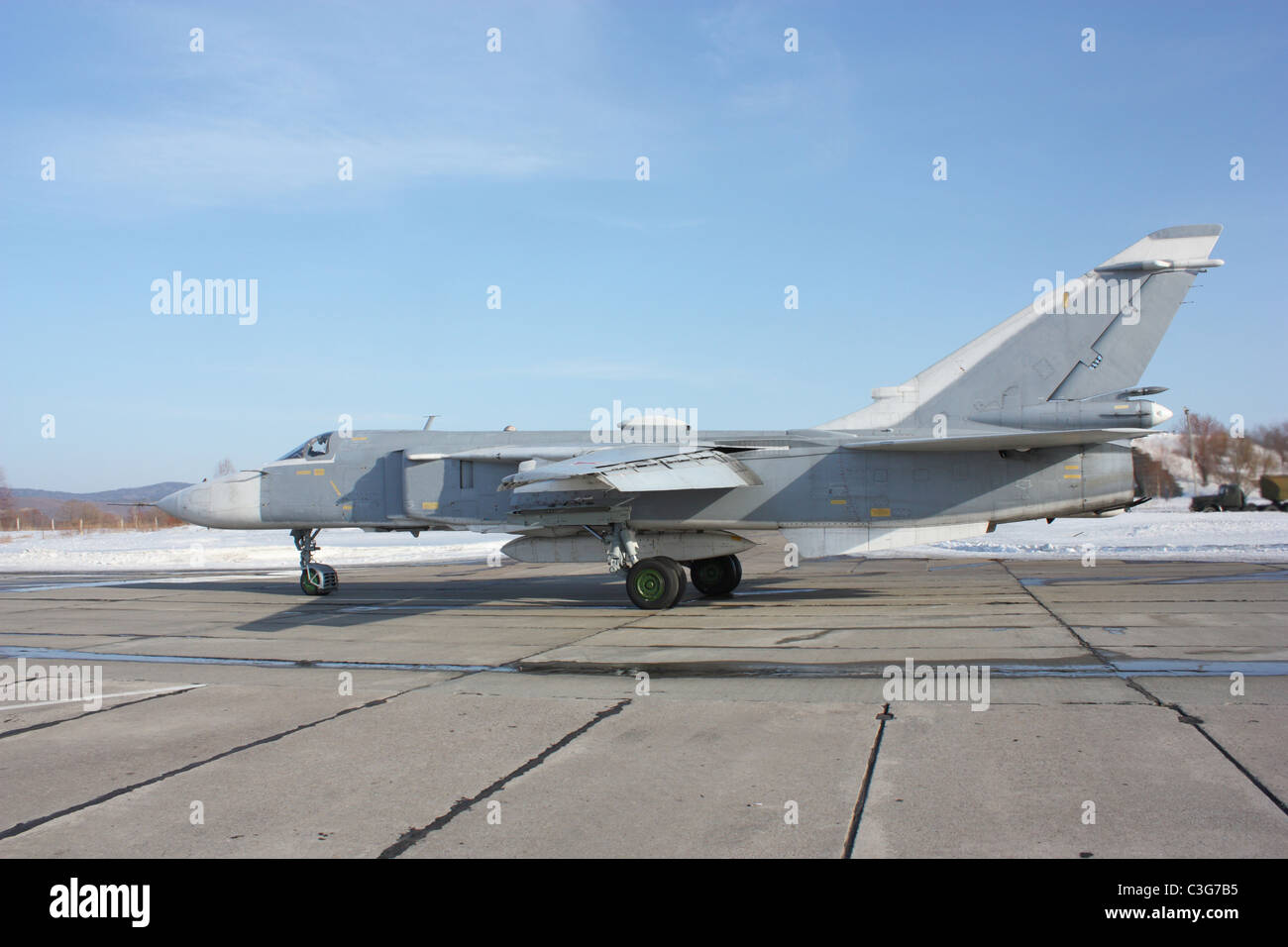 Military jet bomber Su-24 Fencer on take off and landing Stock Photo