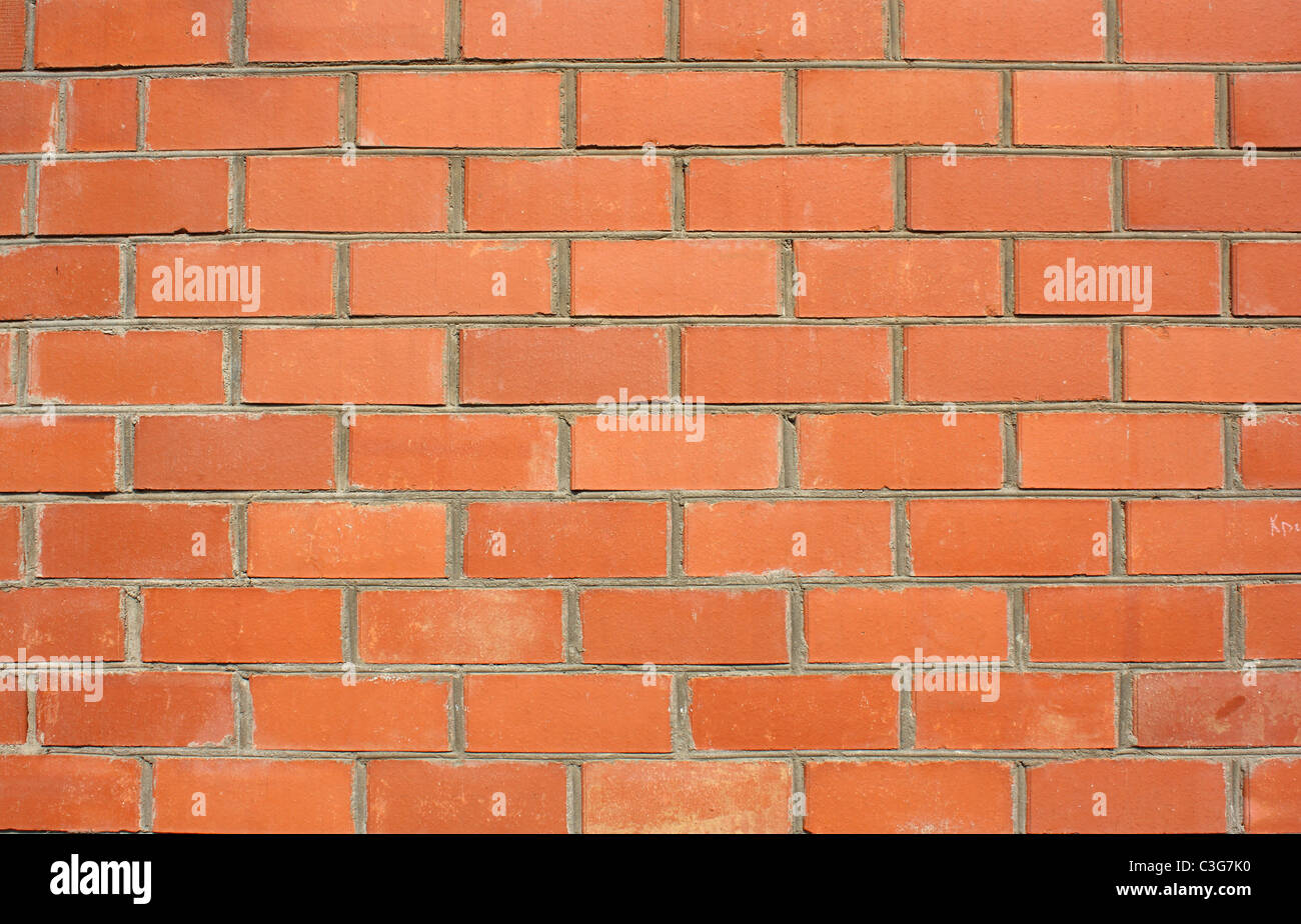 Red brick wall of the house, with lines of a laying of a solution Stock Photo
