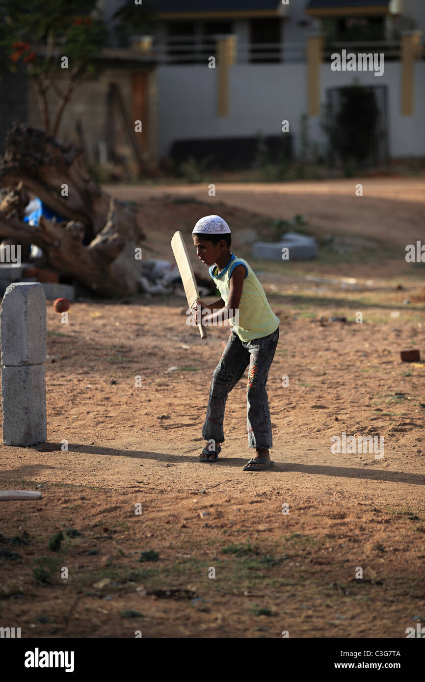 Boy play cricket in Andhra Pradesh South India Stock Photo