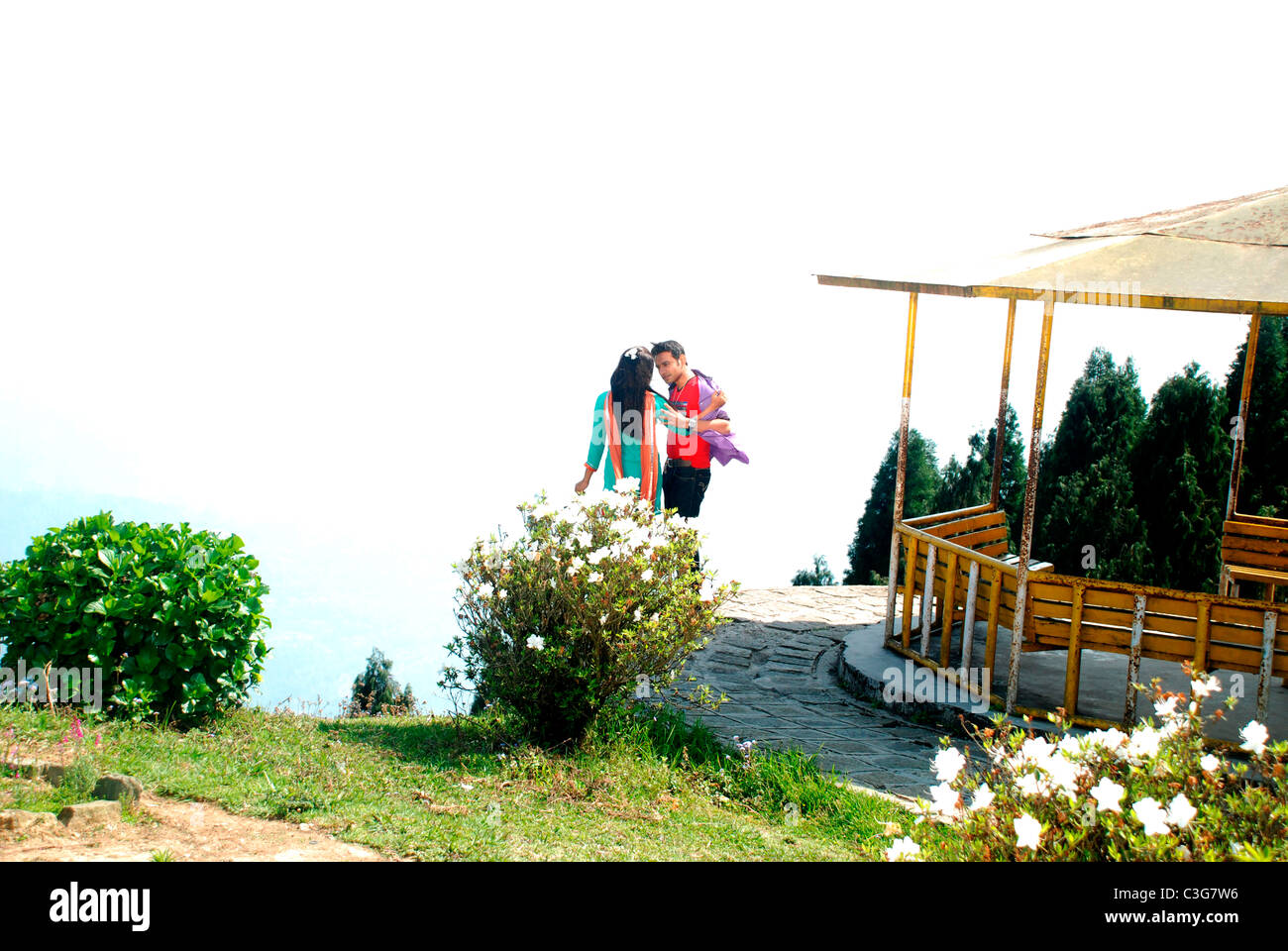 A couple giving romantic pose in a hill station, india Stock Photo - Alamy