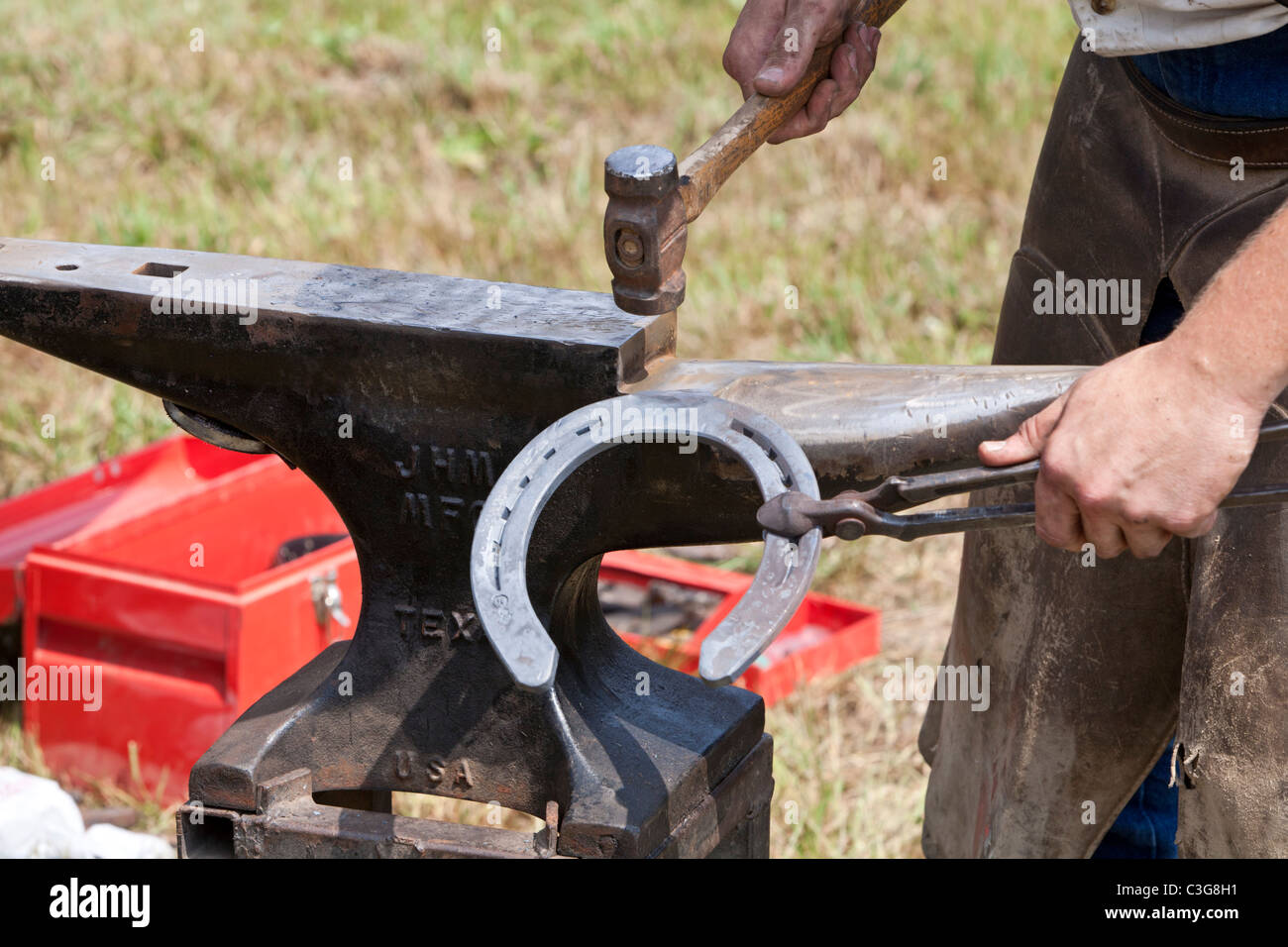 Blacksmith shaping horseshoe for use Stock Photo Alamy