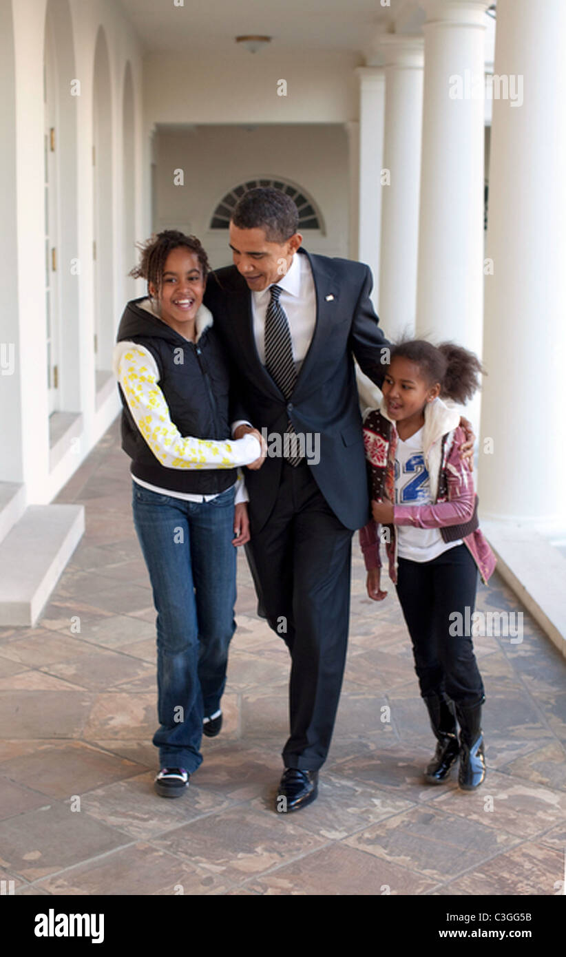 President Barack Obama walks down the Colonnade with his arms around ...