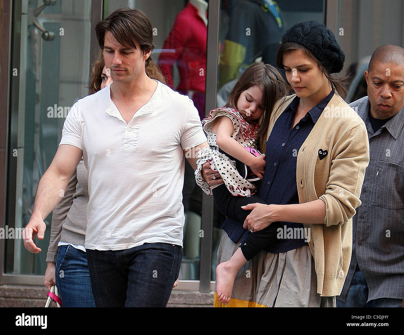 Tom Cruise, Holmes with their daughter Suri leaving Nike store Boston, MA - 04.10.09 Stock - Alamy
