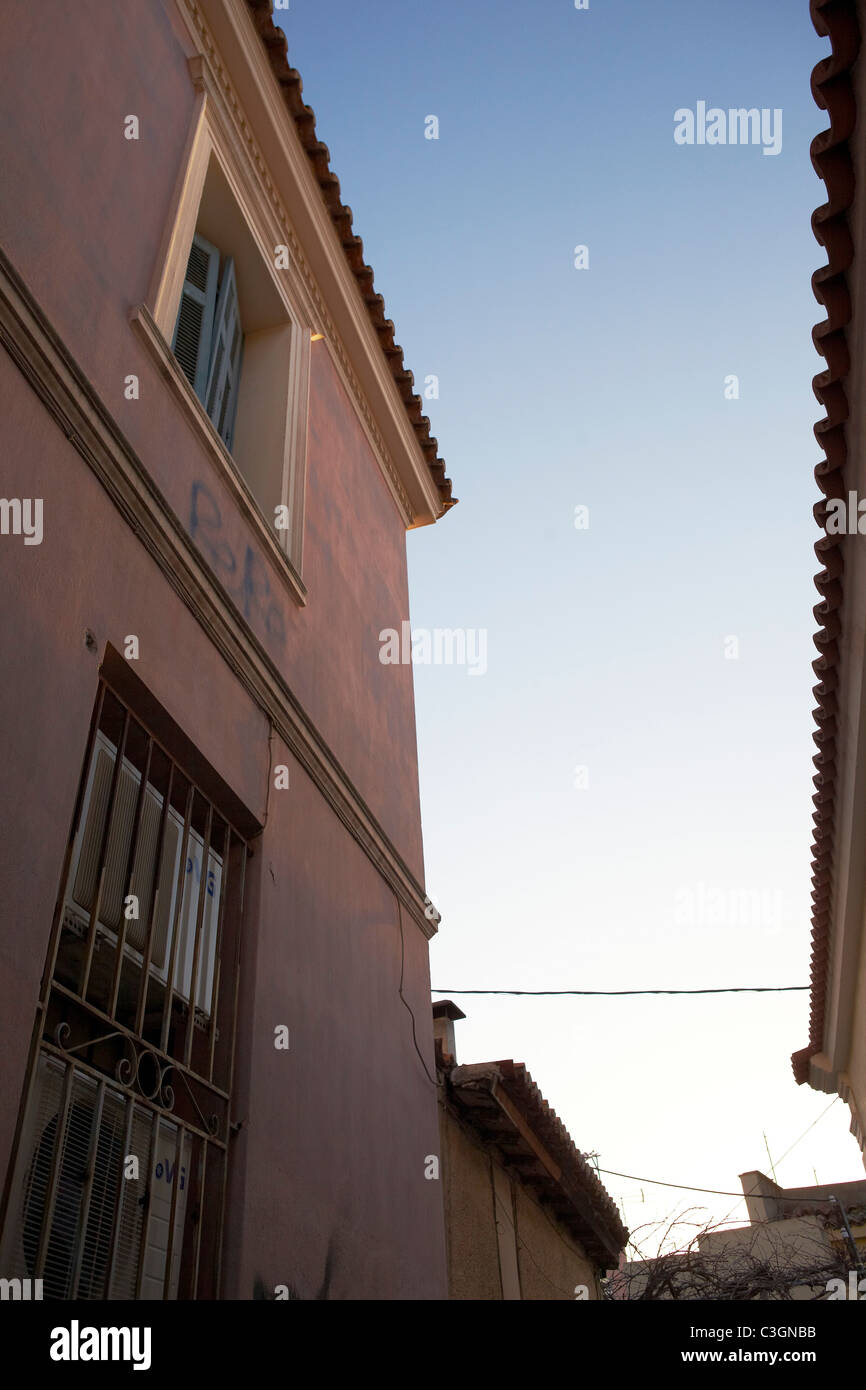 Pink building narrow street athens hires stock photography and images