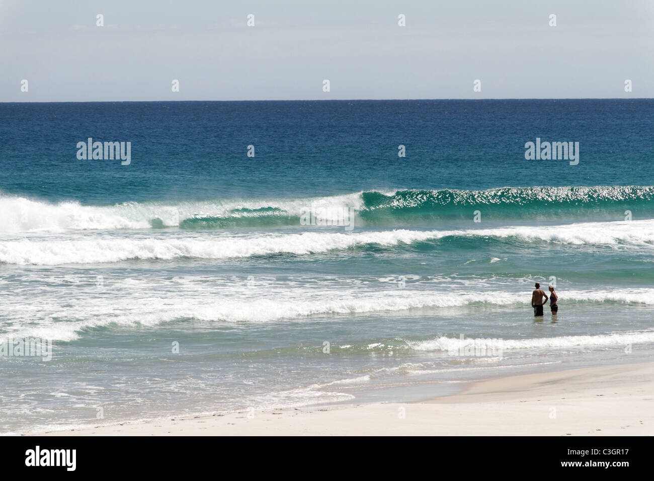 2 People standing water Salmon Beach, D'Entrecasteuax National Park, Southwest Australia Stock Photo
