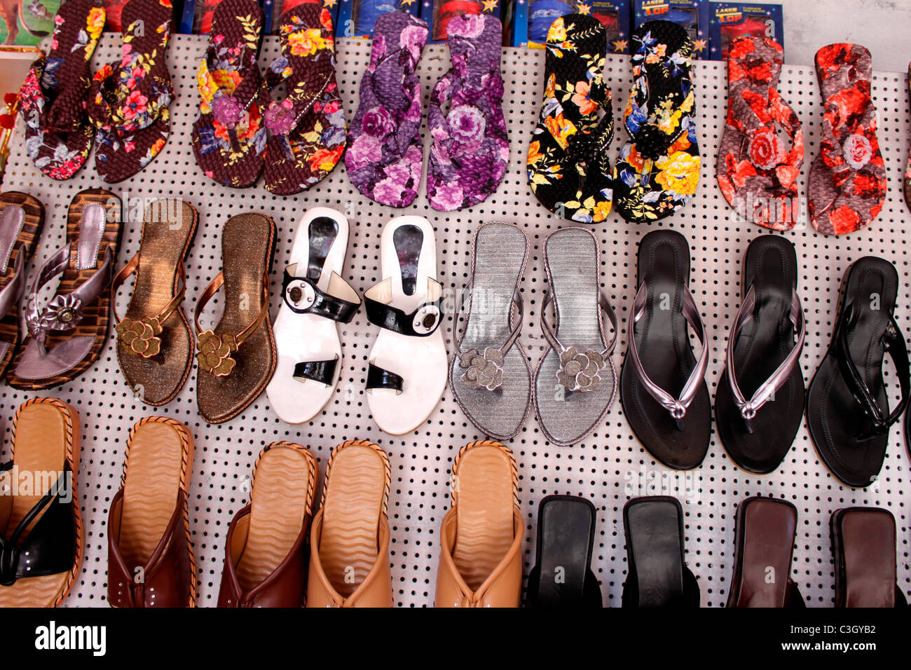Slippers on display in an indian shop Stock Photo - Alamy