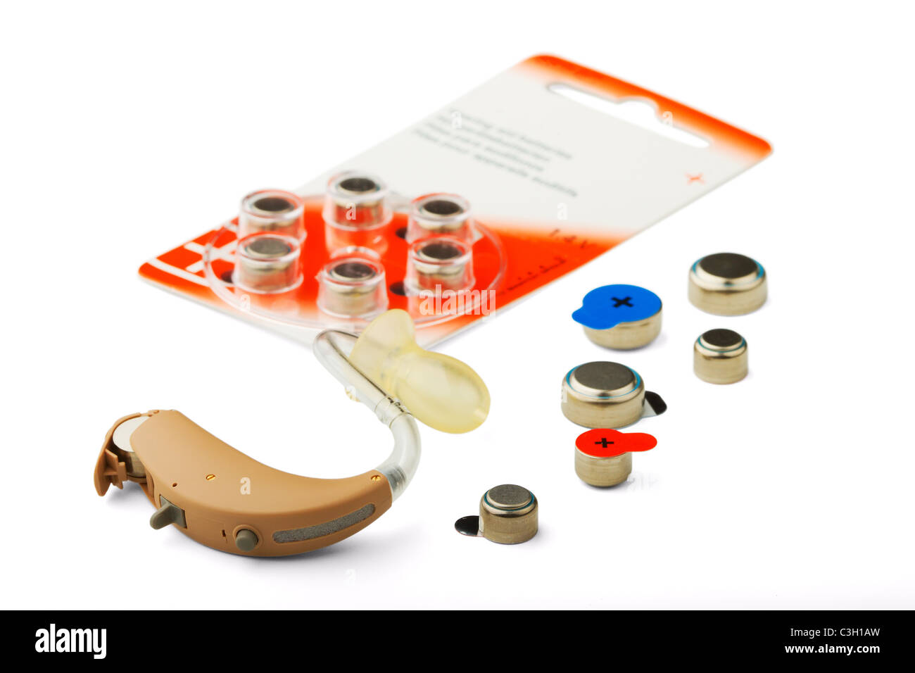 The hearing aid and battery isolated on a white background Stock Photo
