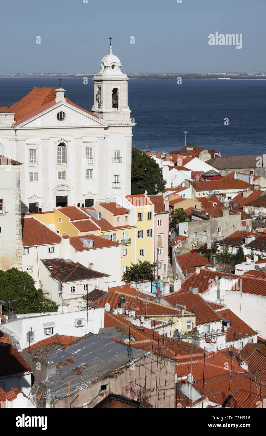 Lisbon Portugal view across the Alfama district featuring the Santo Estevao church Stock Photo