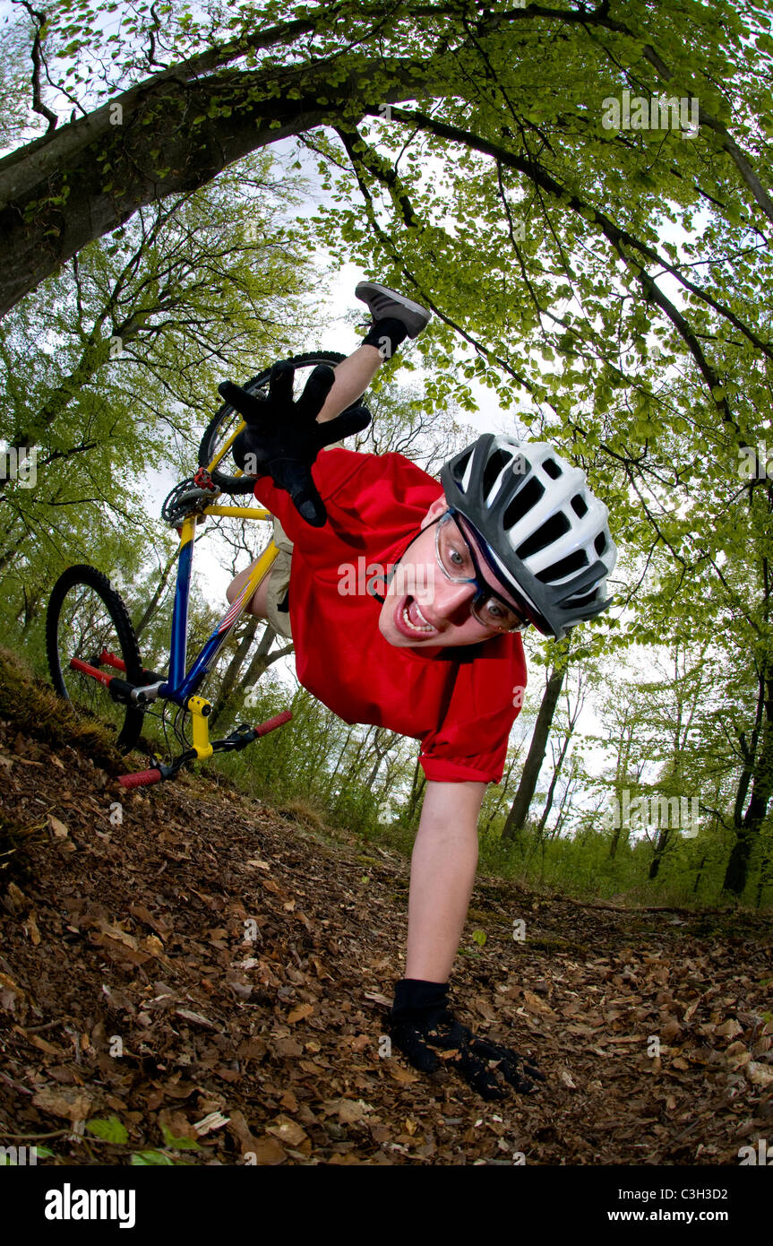 Young man falling off of bicycle dramatically Stock Photo - Alamy